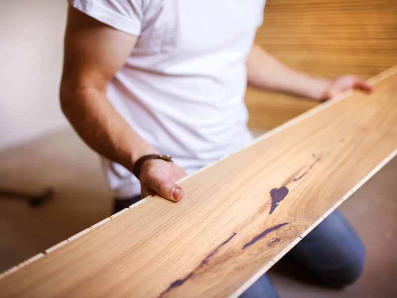 Flooring contractor installing hardwood