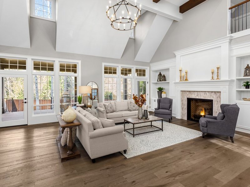 brown hardwood and white rug in living room from Carpet Galore and Flooring in Grafton, WI area